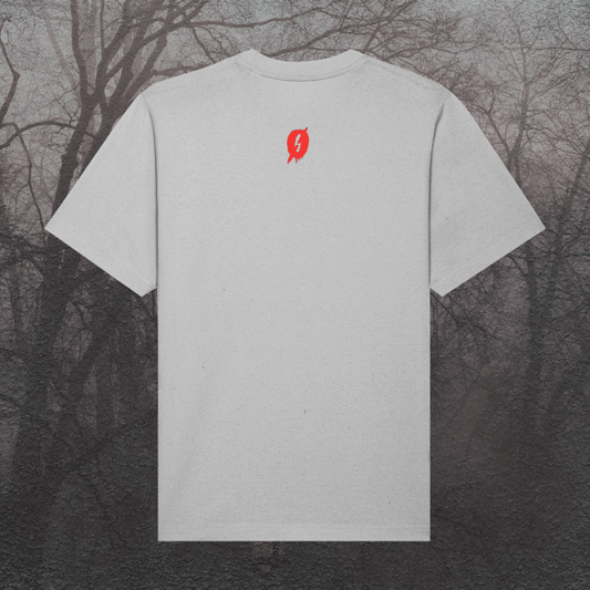 Gray t-shirt with a red logo on the back against a dark, leafless tree background
