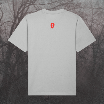 Gray t-shirt with a red logo on the back against a dark, leafless tree background